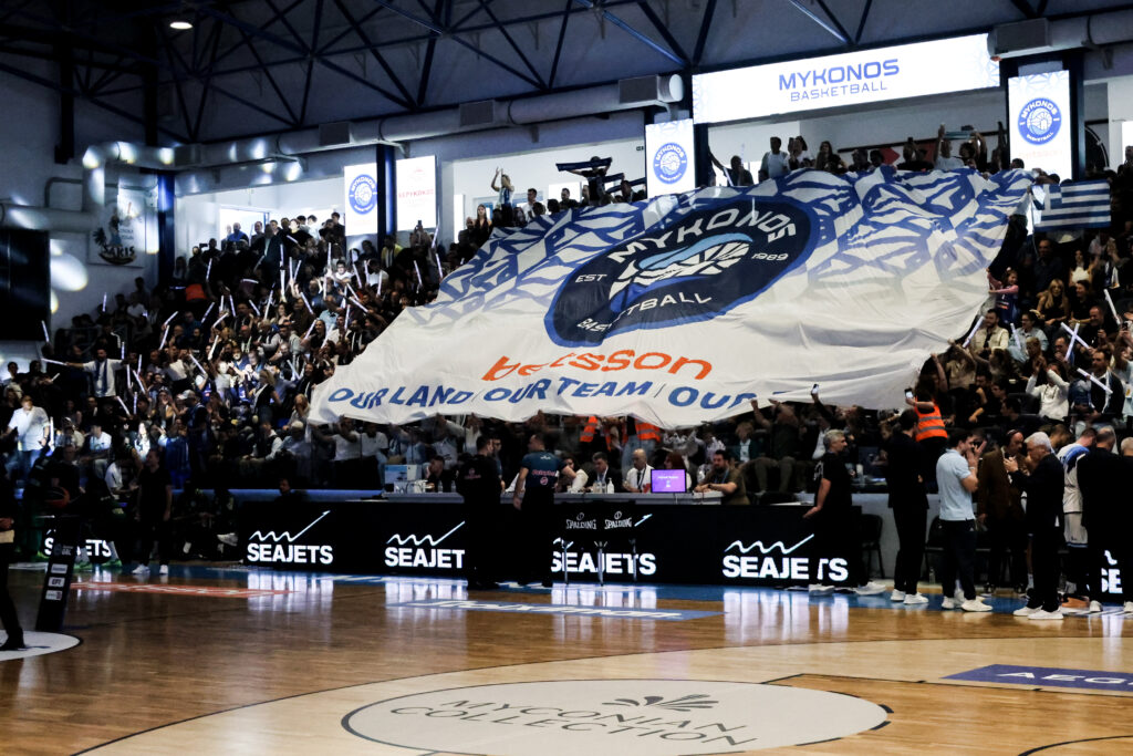 More than 1,000 Mykonos fans pack the gym for every game — roughly one-eighth of the island’s winter population.