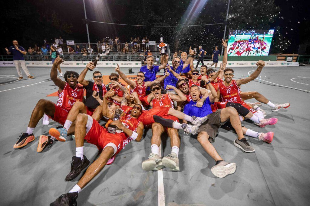 The winners celebrate their triumph on the concrete.