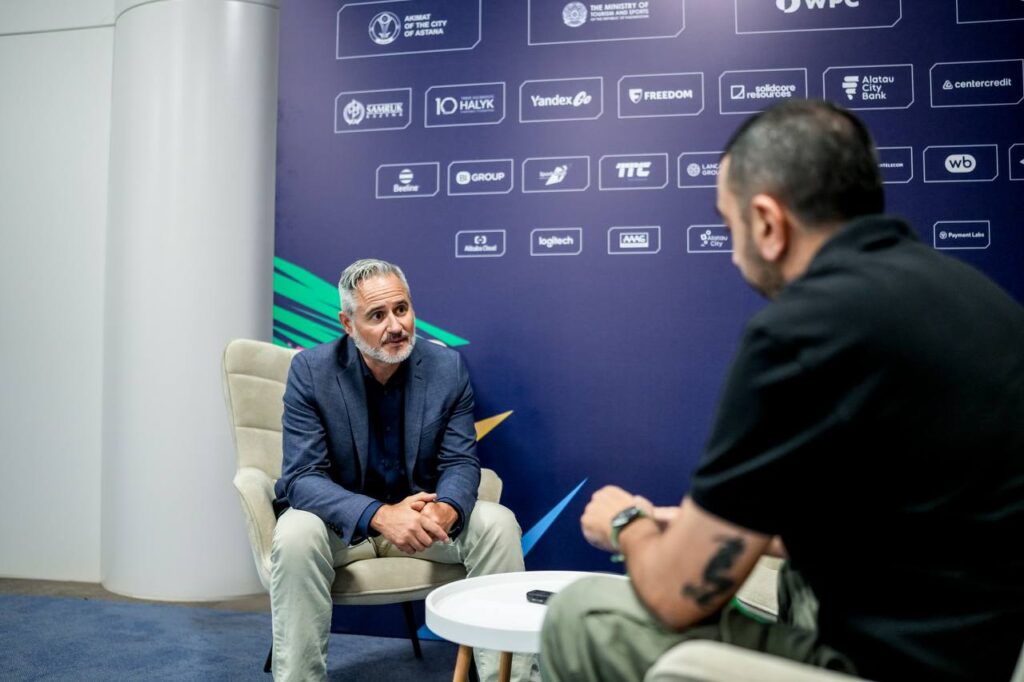 Dan Merkley, CEO of Phygital International, with SKWEEK Editor-in-Chief Giannis Stavroulakis during the Games of the Future 2026 in Astana.